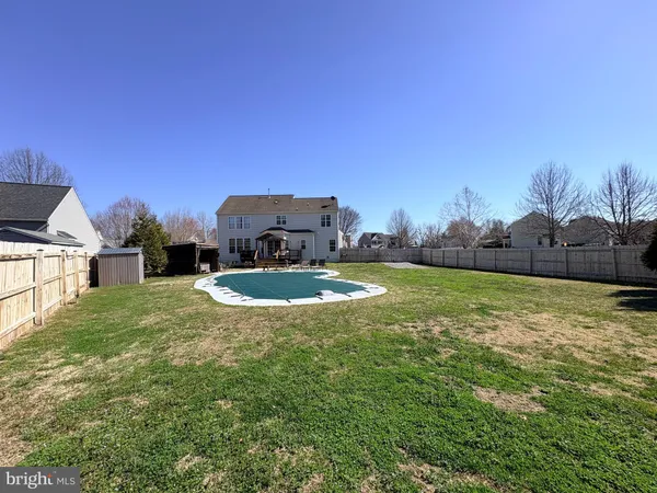 a view of swimming pool with skyline in background
