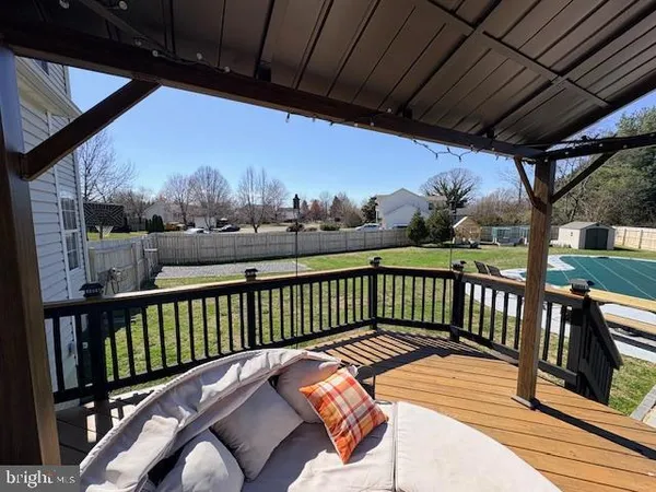 a view of a backyard with swimming pool
