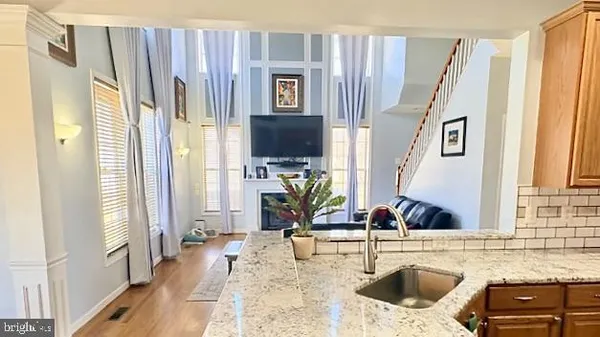 a front view of house with yard and car parked