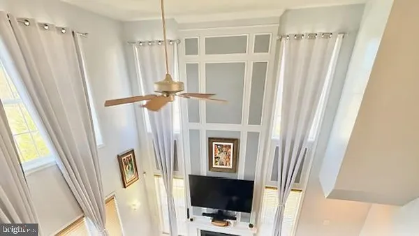 a car parked in front of a house with a big yard