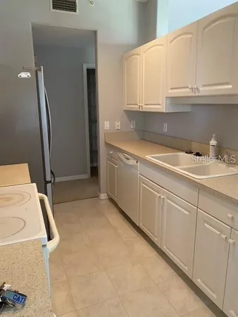 a kitchen with a sink and cabinets