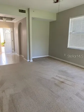 a view of a livingroom with a staircase