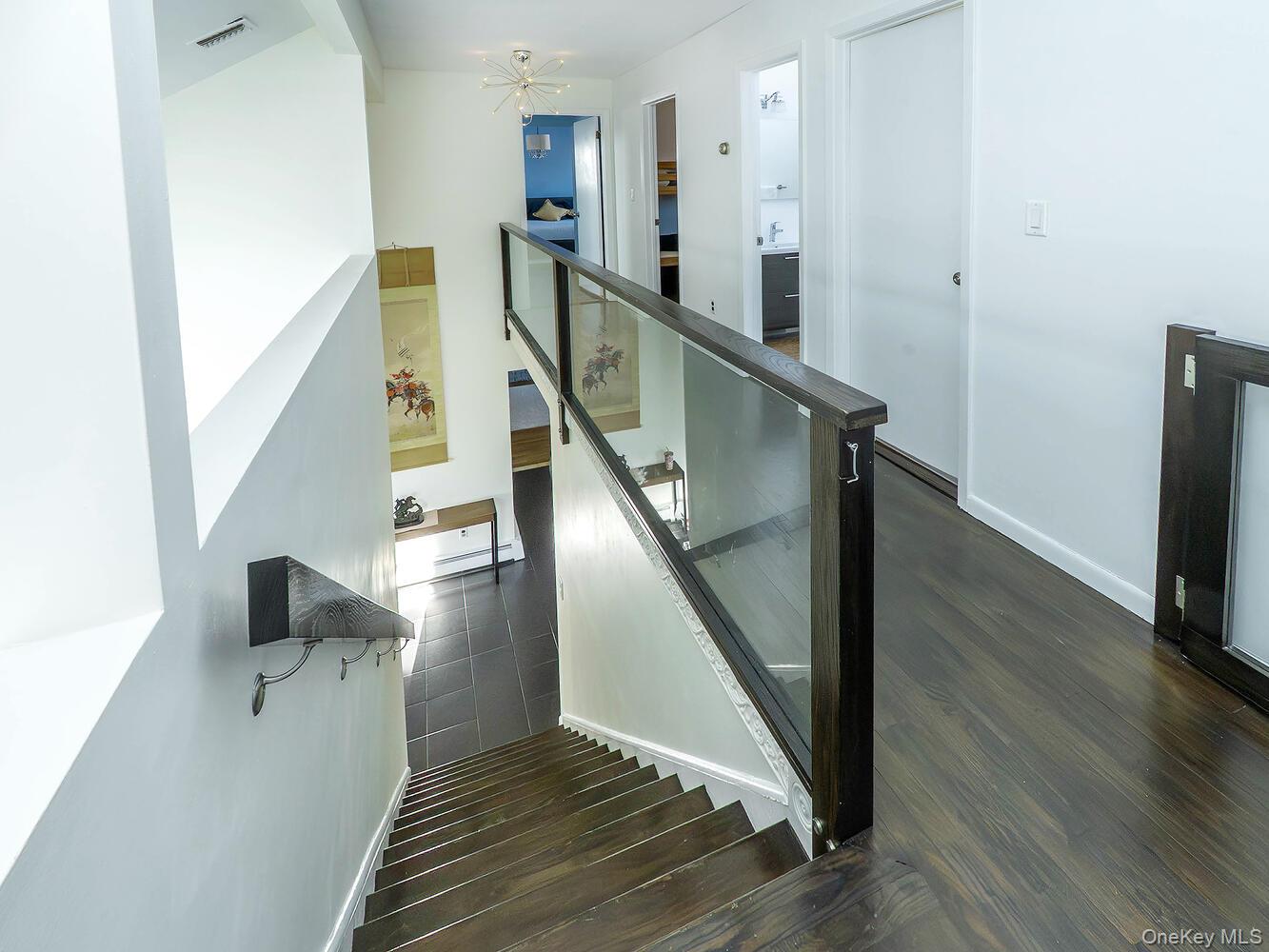 127 Cow Neck Road Port Washington, NY 11050 - Photo 15 of 31 a view of entryway and hall with wooden floor
