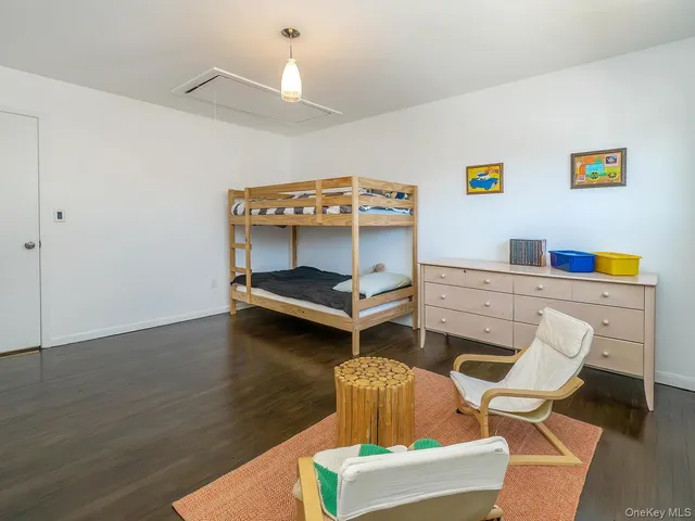 a bedroom with a bed and a desk