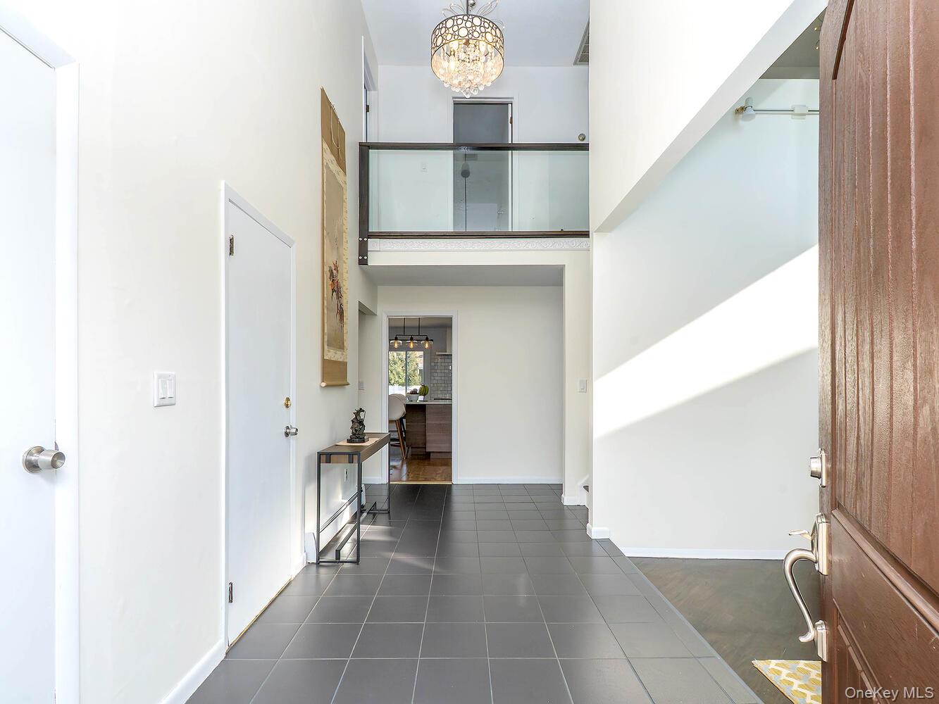 127 Cow Neck Road Port Washington, NY 11050 - Photo 2 of 31 a view of living room with furniture and window