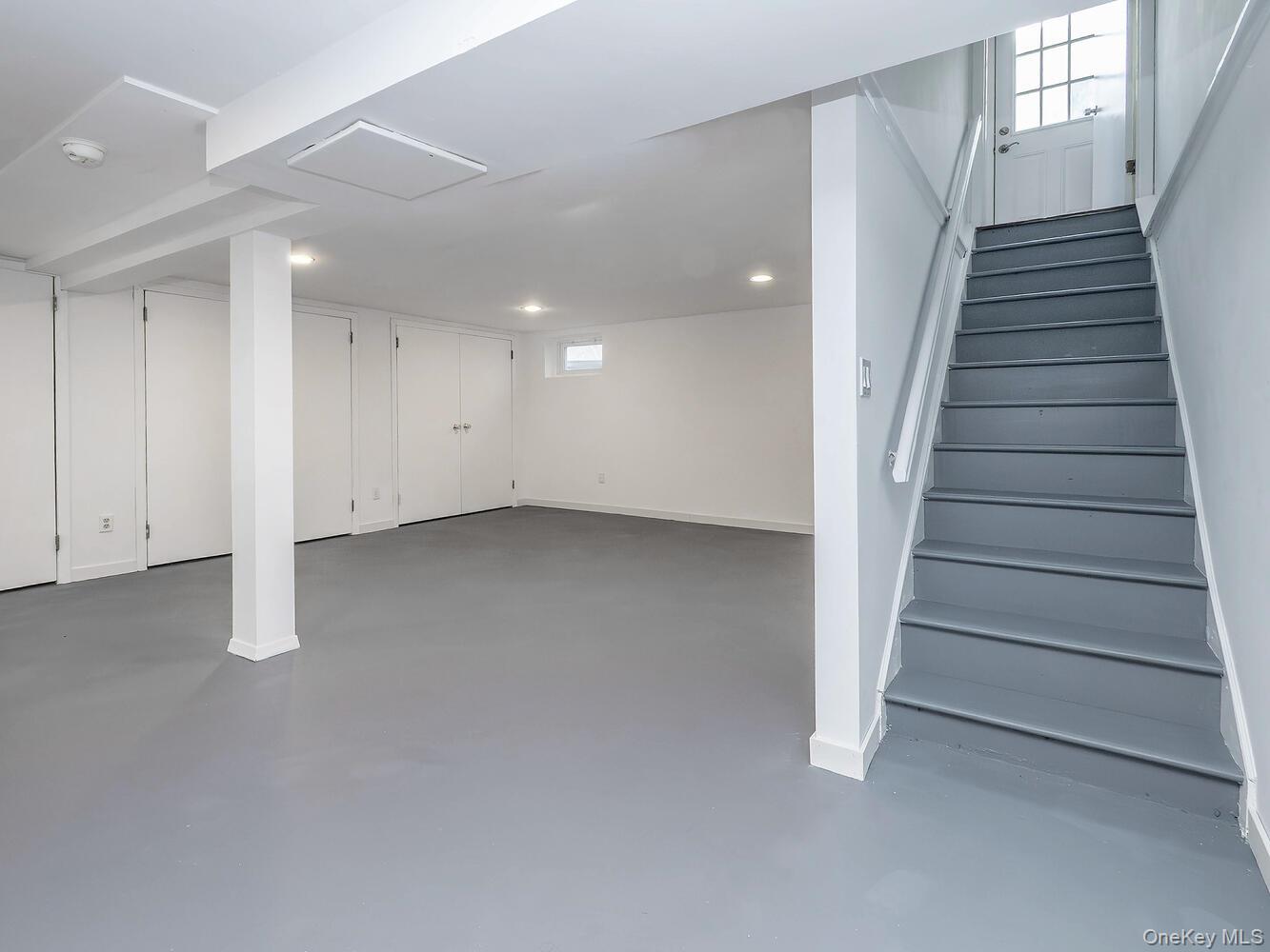 127 Cow Neck Road Port Washington, NY 11050 - Photo 26 of 31 a view of an empty room with stairs