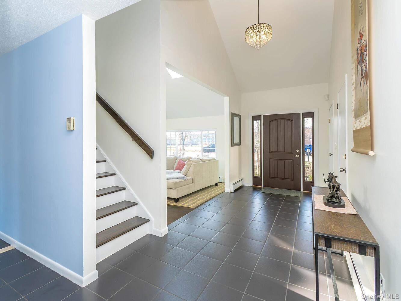 127 Cow Neck Road Port Washington, NY 11050 - Photo 3 of 31 a view of an entryway with livingroom