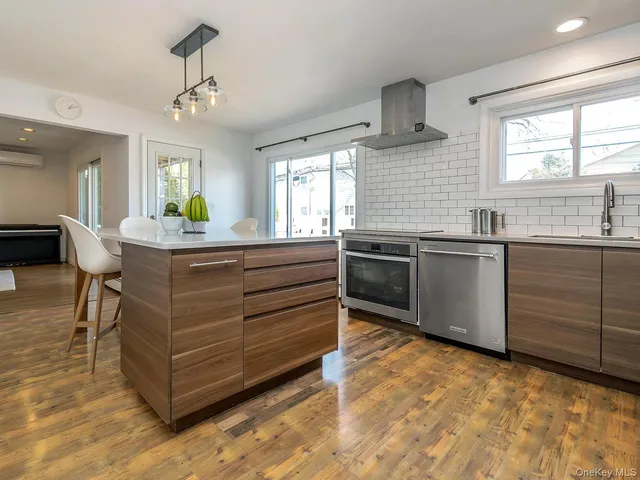 a kitchen with granite countertop a sink and cabinets