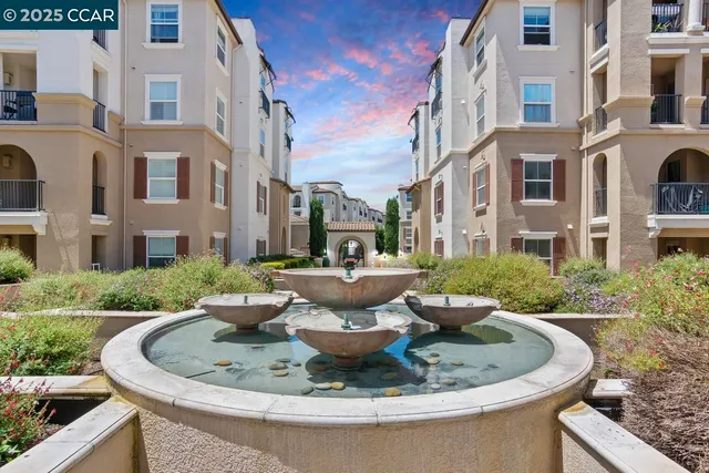 a view of a building with fountain in front of a house