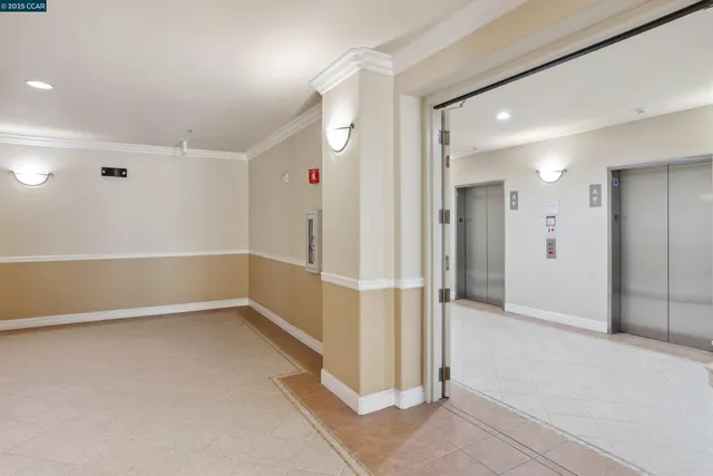 a view of a hallway with wooden shelves
