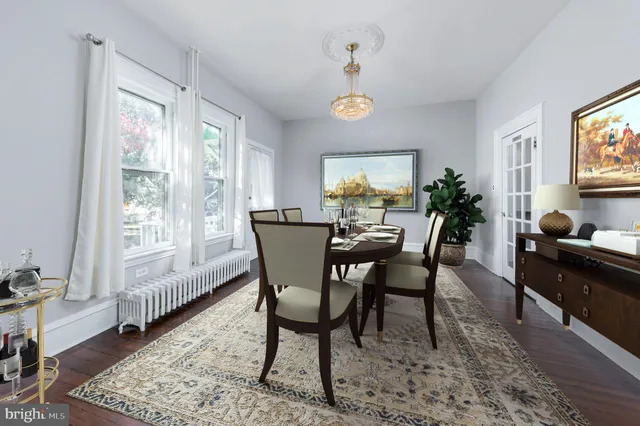 a dining room with furniture and window