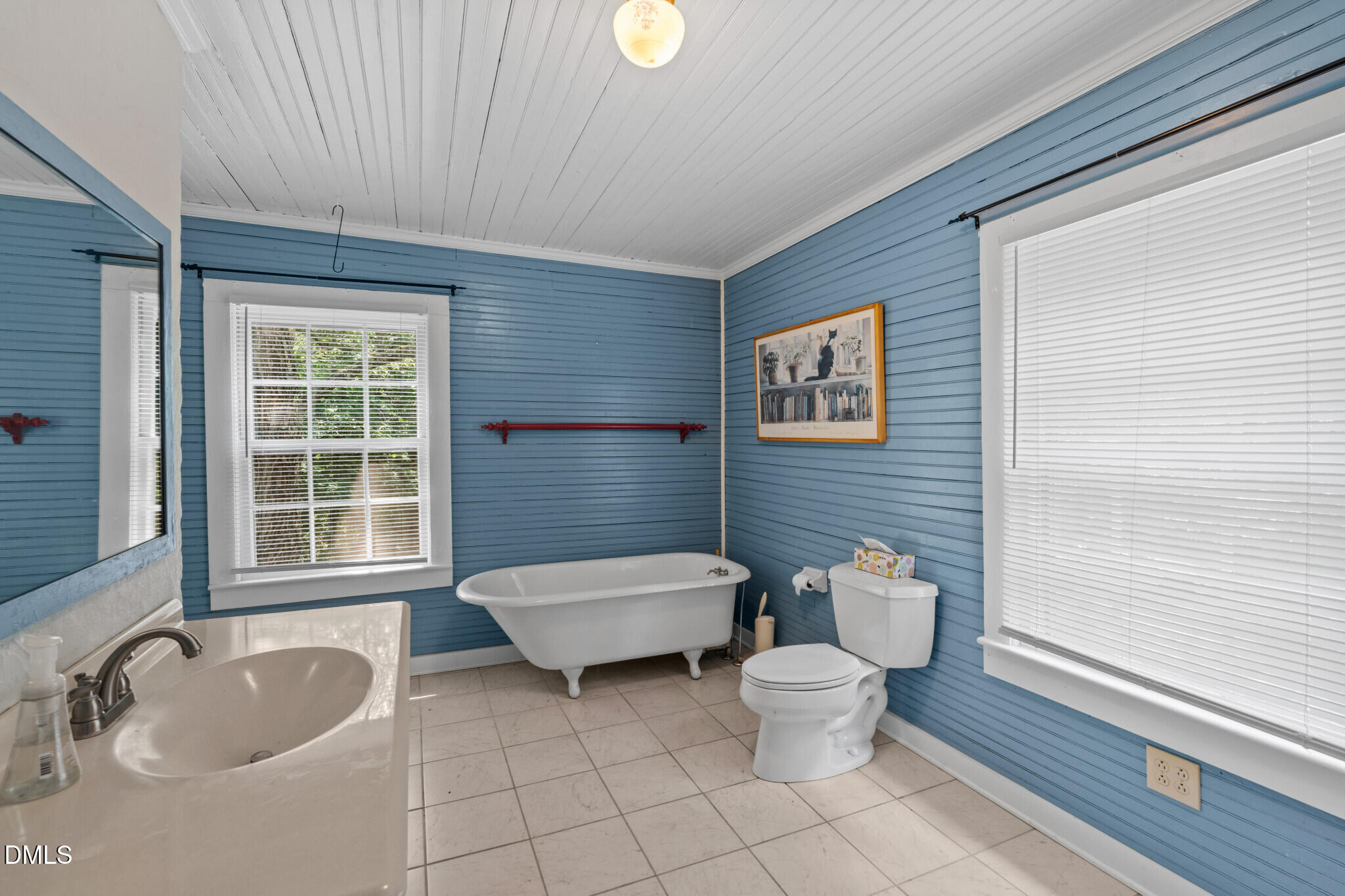 3415 Mt Willing Road Efland, NC 27243 - Photo 15 of 36 a bathroom with a toilet sink and mirror