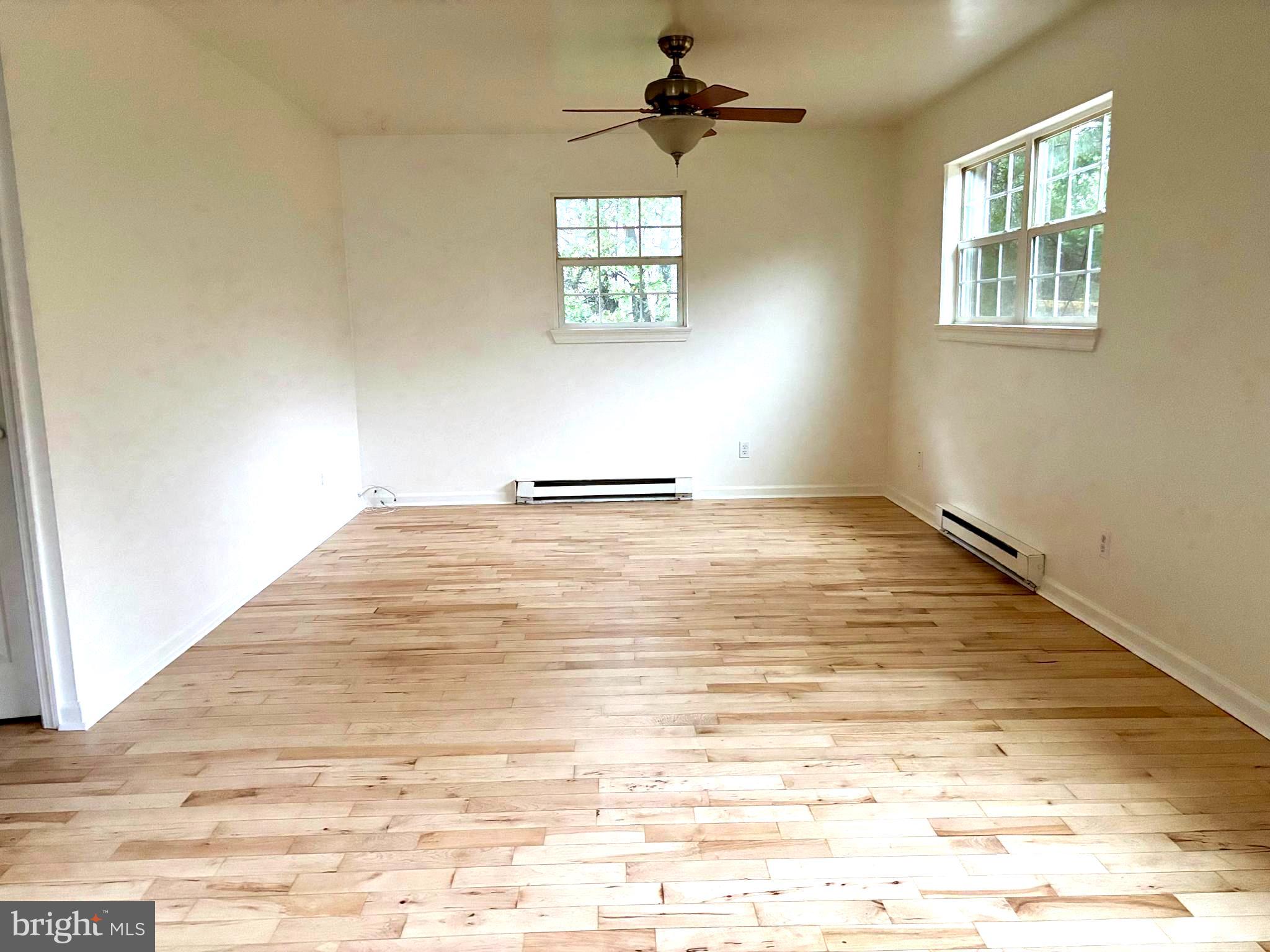 19 Walnut Street, Unit B Williamstown, NJ 08094 - Photo 2 of 9 a view of an empty room and window