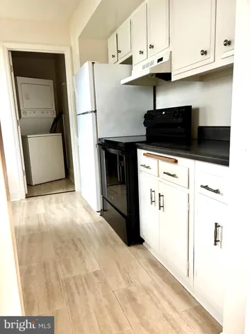 a view of a kitchen with electric appliances