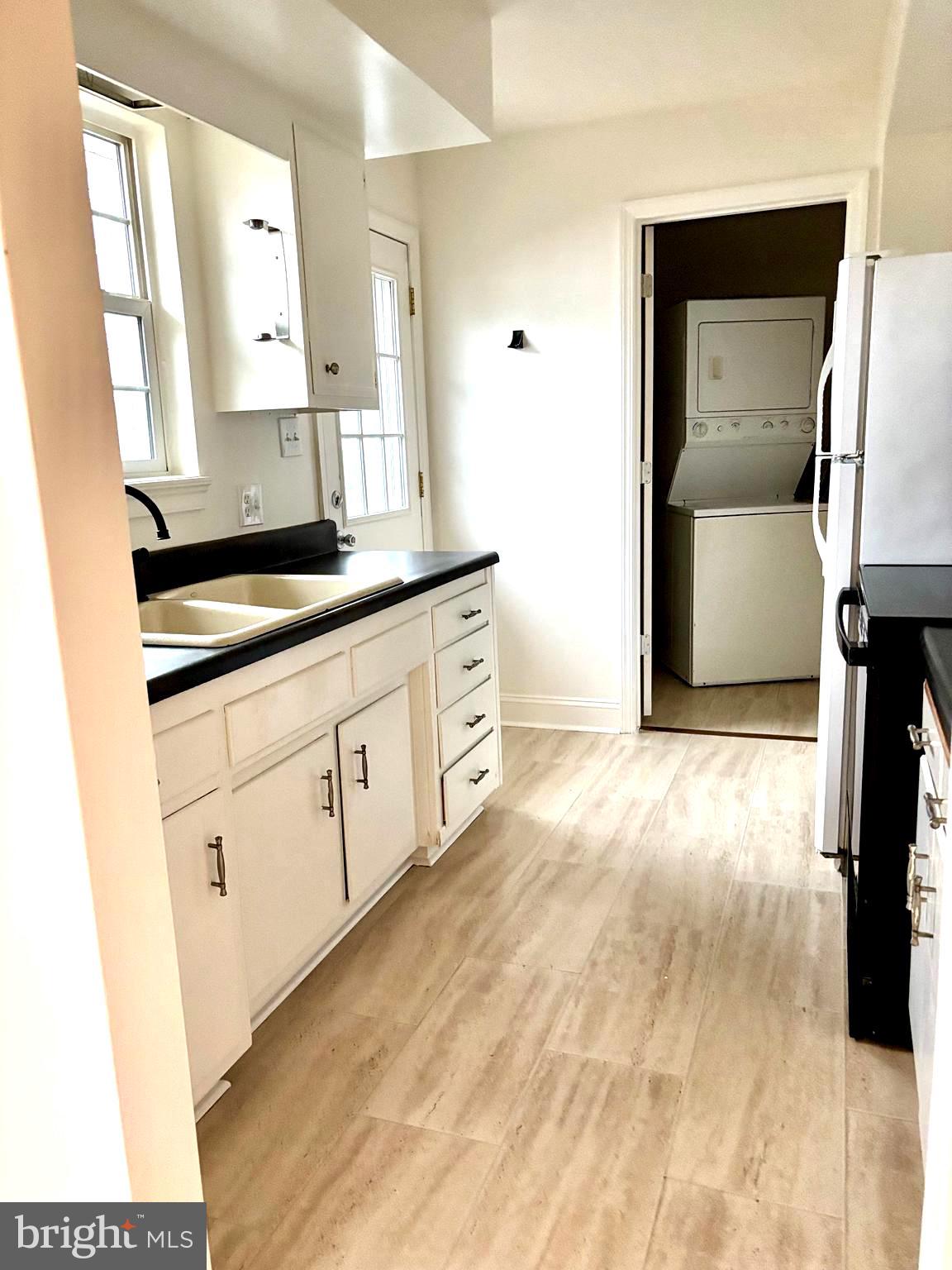 19 Walnut Street, Unit B Williamstown, NJ 08094 - Photo 7 of 9 a bathroom with a sink and a mirror