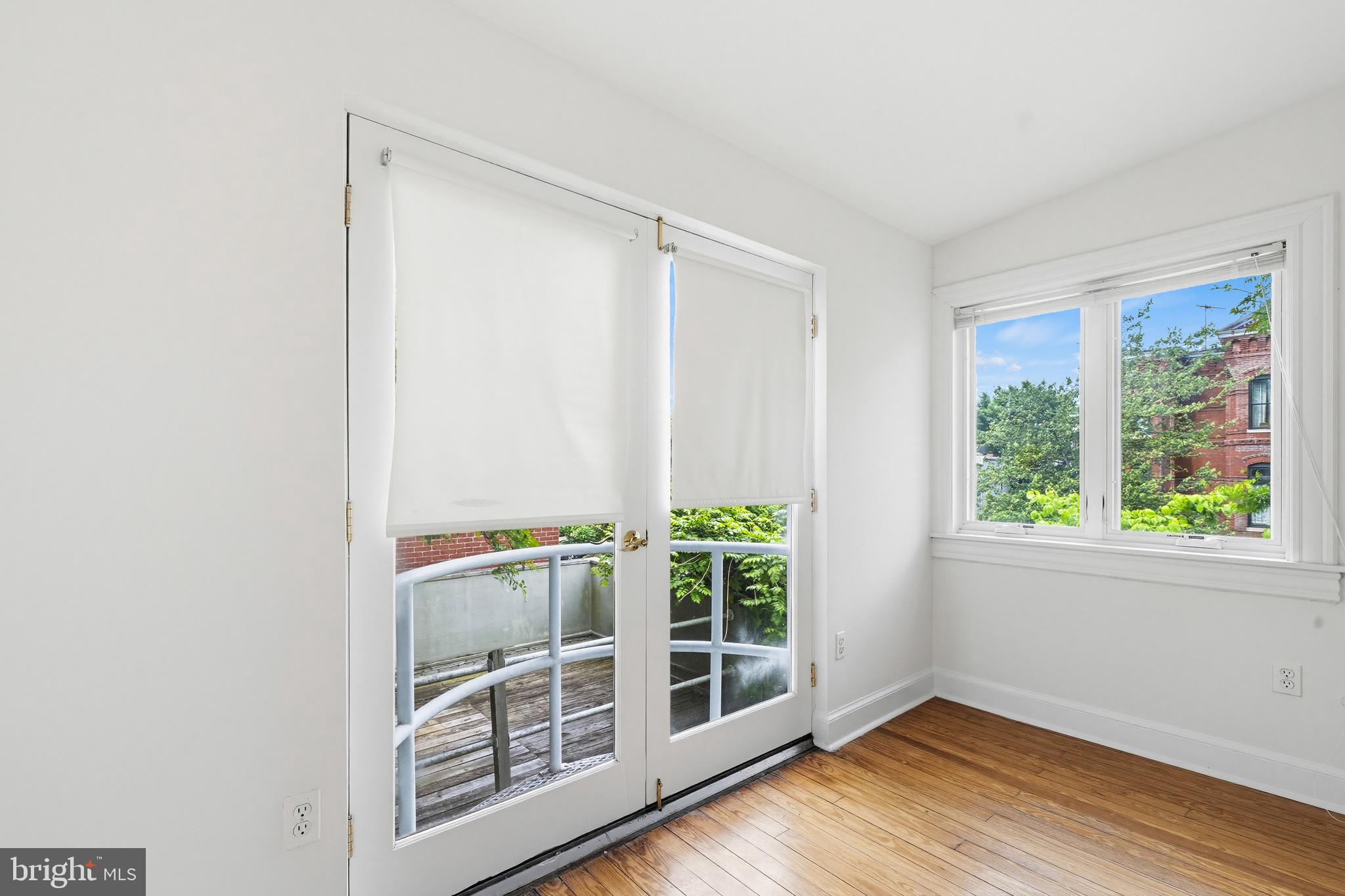 400 7th Street Southeast Washington, DC 20003 - Photo 19 of 23 a view of an empty room with wooden floor and a window