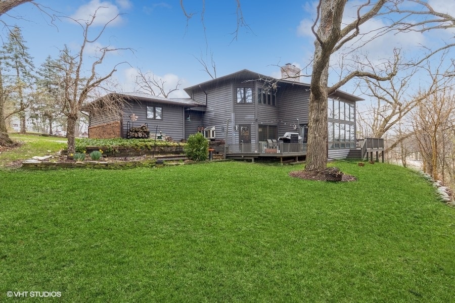 155 Forestview Drive Elgin, IL 60120 - Photo 1 of 36 a view of a house with a big yard and large trees