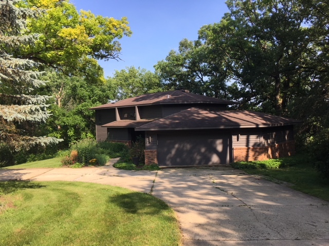 155 Forestview Drive Elgin, IL 60120 - Photo 11 of 36 a front view of a house with a yard