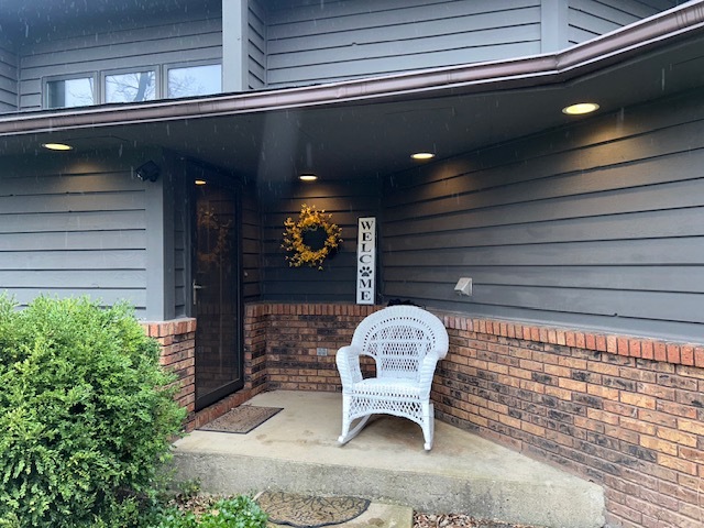 155 Forestview Drive Elgin, IL 60120 - Photo 13 of 36 a bench sitting in front of a building