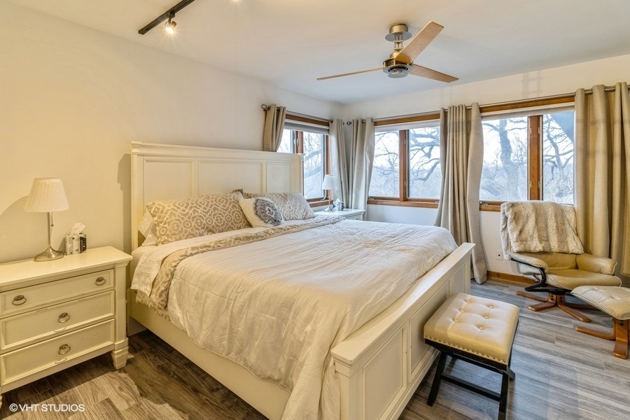155 Forestview Drive Elgin, IL 60120 - Photo 16 of 36 a bedroom with a bed and wooden floor