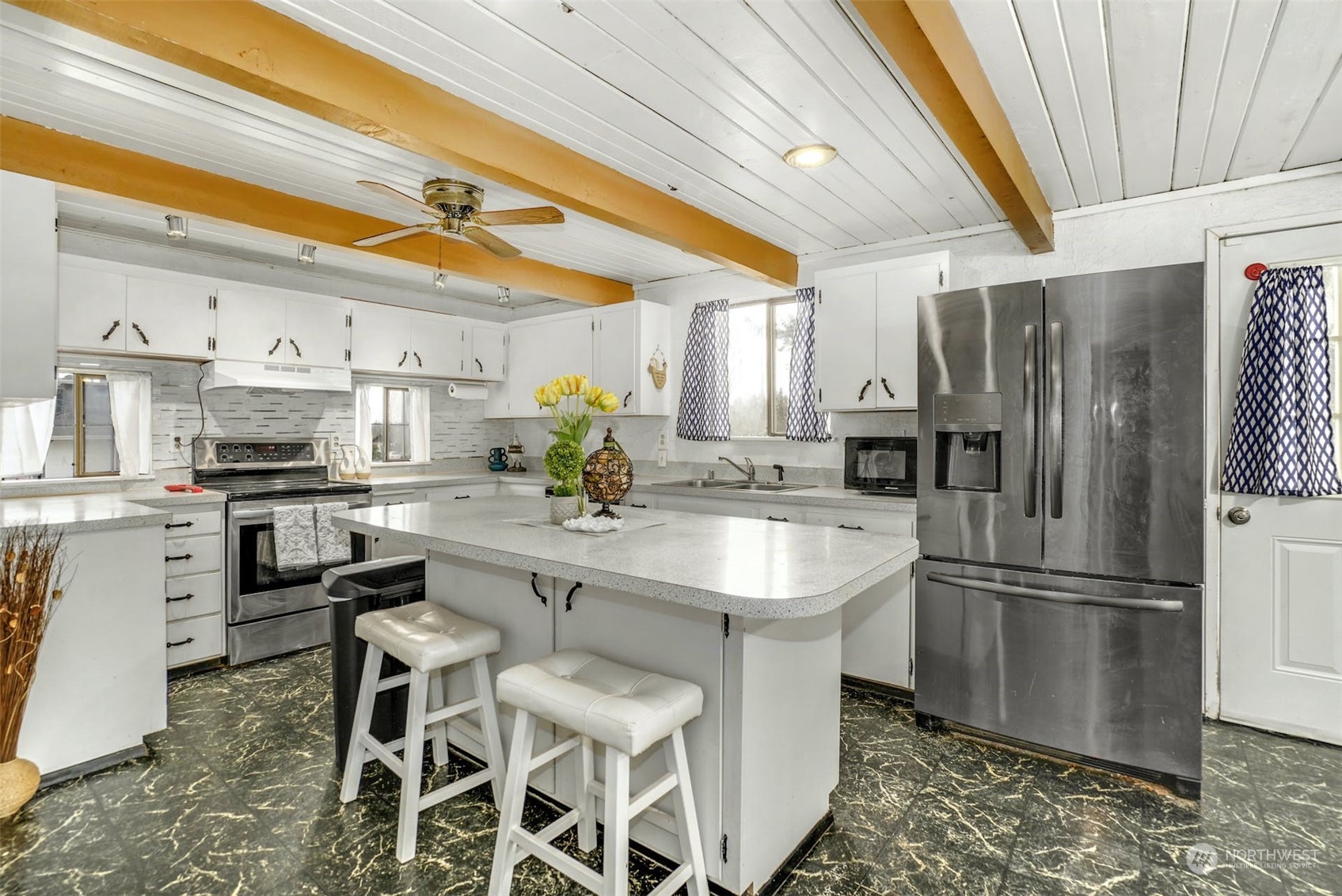 12006 Alexander Road Everett, WA 98204 - Photo 1 of 33 a kitchen with appliances a sink and cabinets