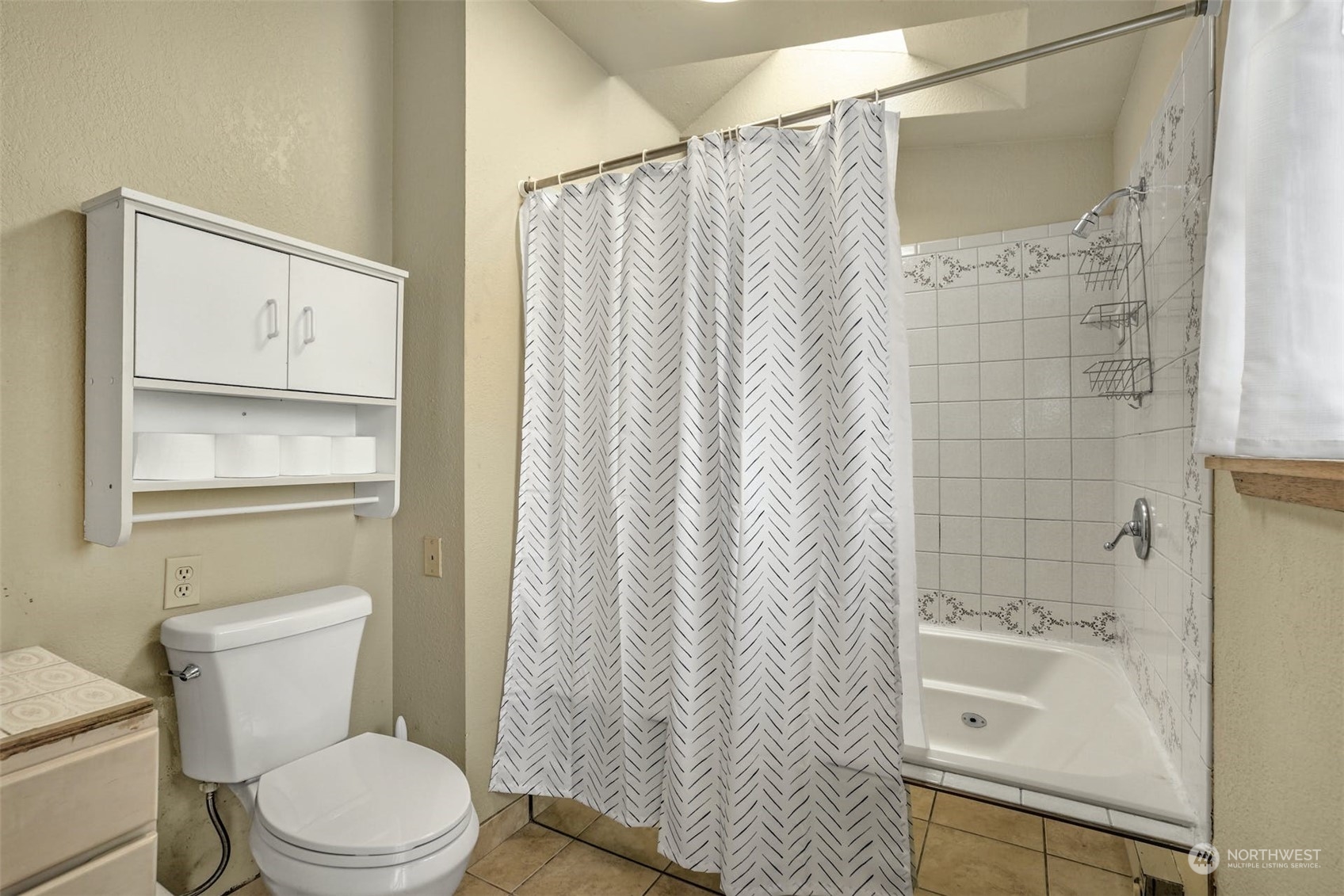 12006 Alexander Road Everett, WA 98204 - Photo 17 of 33 a bathroom with a sink toilet and shower