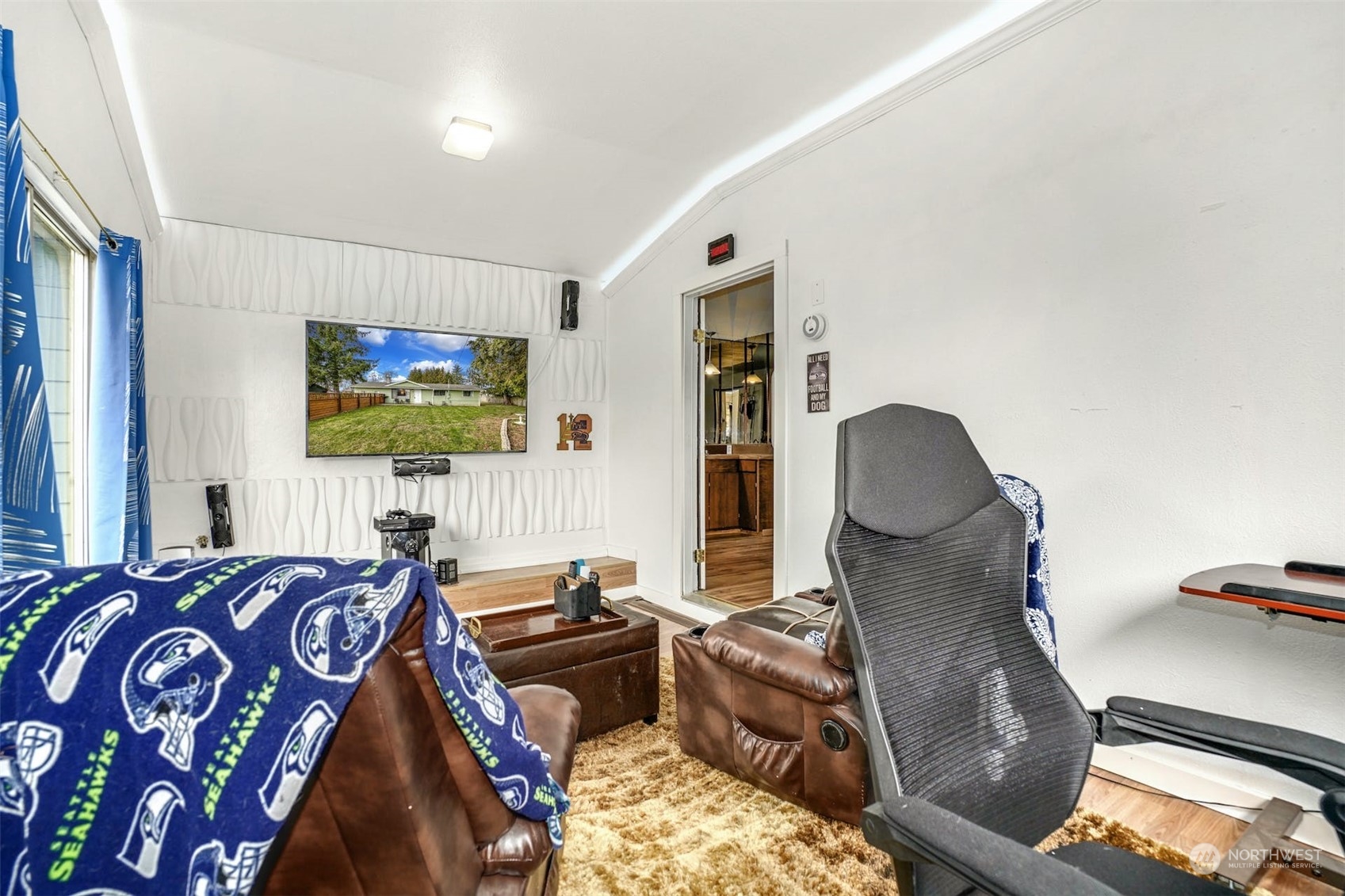 12006 Alexander Road Everett, WA 98204 - Photo 23 of 33 a living room with furniture a flat screen tv and a window