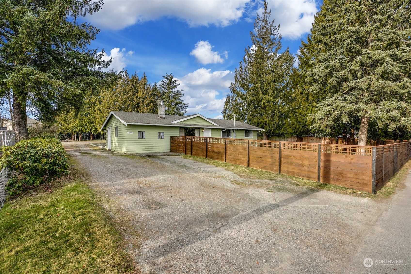 12006 Alexander Road Everett, WA 98204 - Photo 29 of 33 a front view of a house with a yard and garage