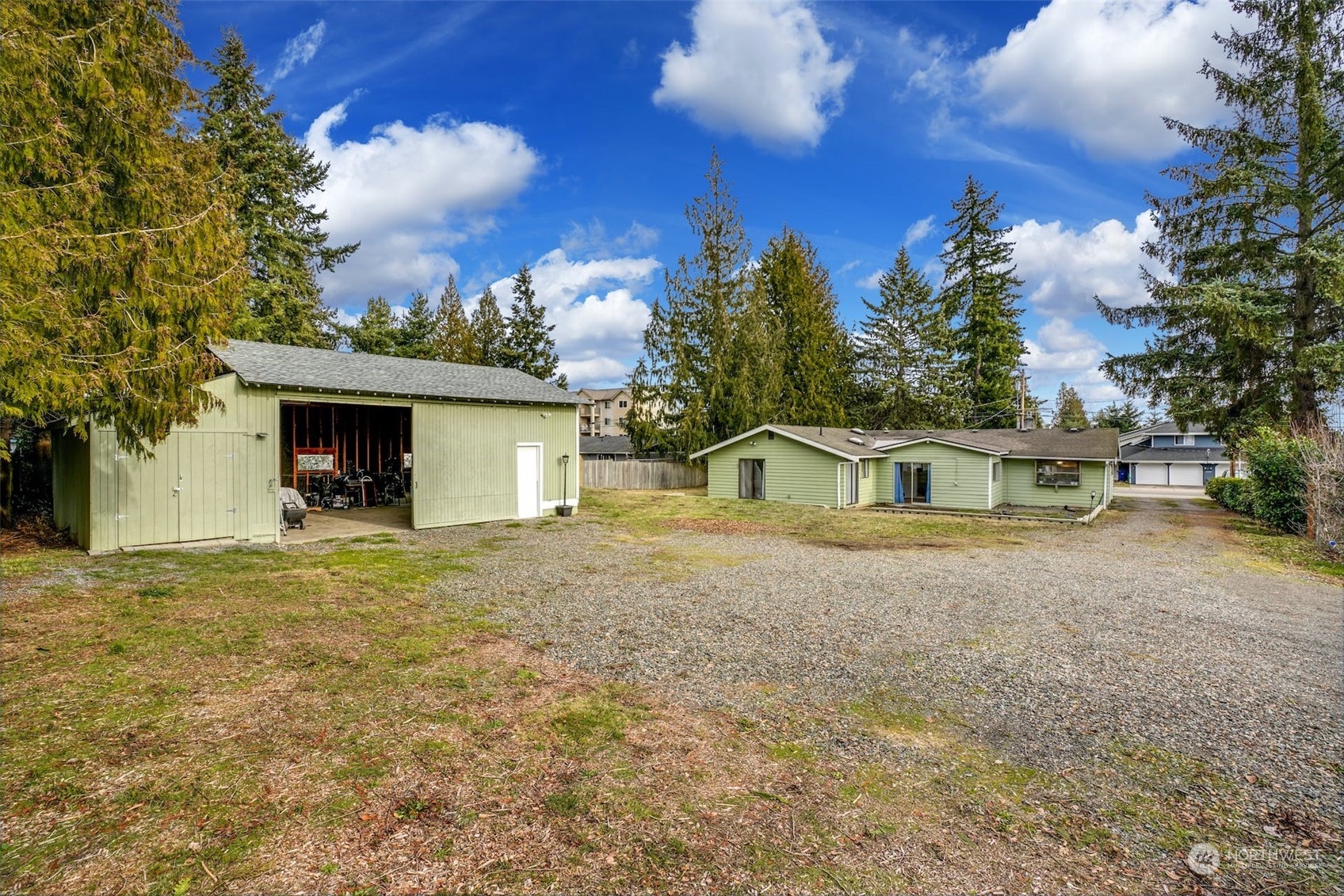 12006 Alexander Road Everett, WA 98204 - Photo 3 of 33 a front view of a house with a yard and garage