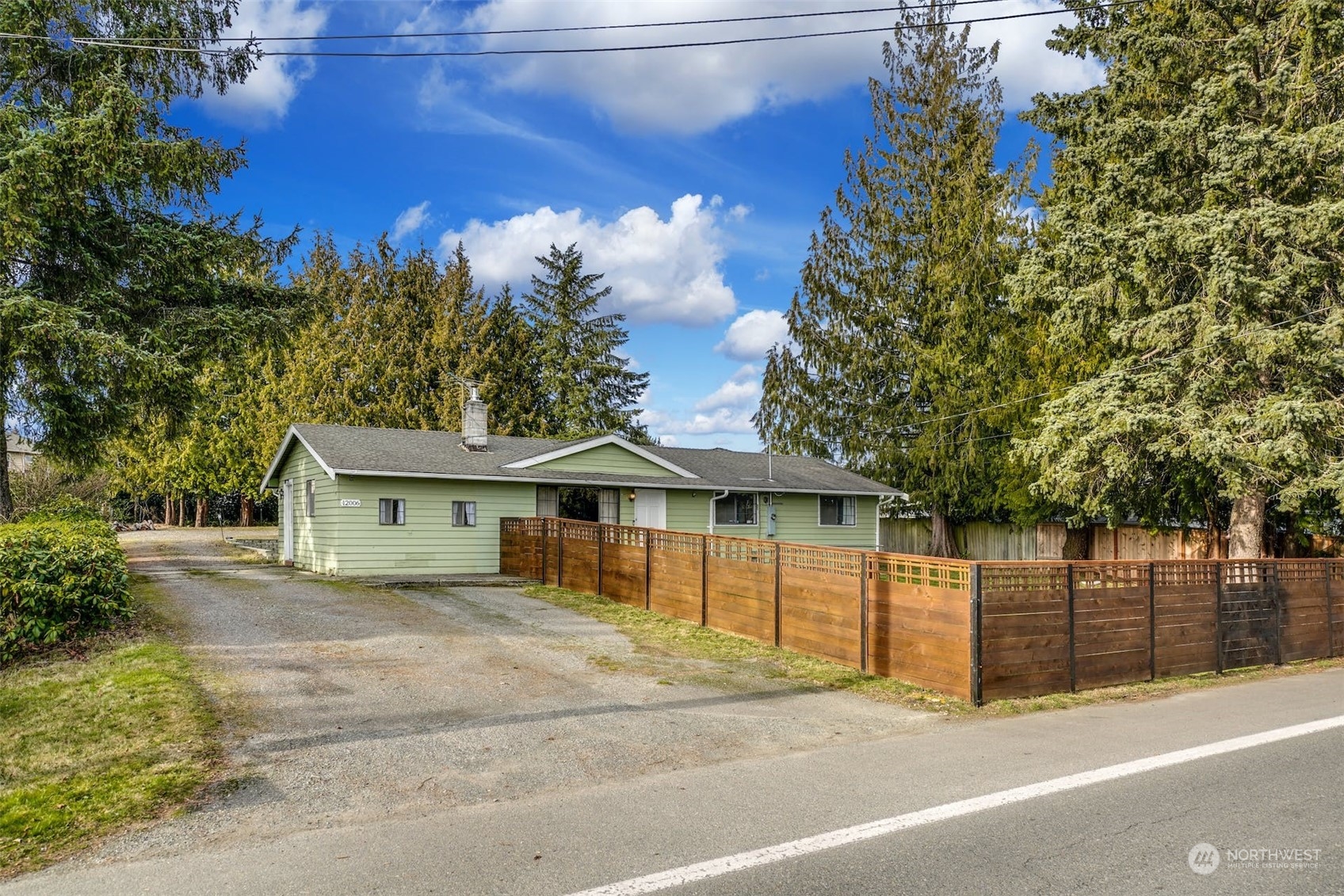 12006 Alexander Road Everett, WA 98204 - Photo 33 of 33 a house with a tree in front of it