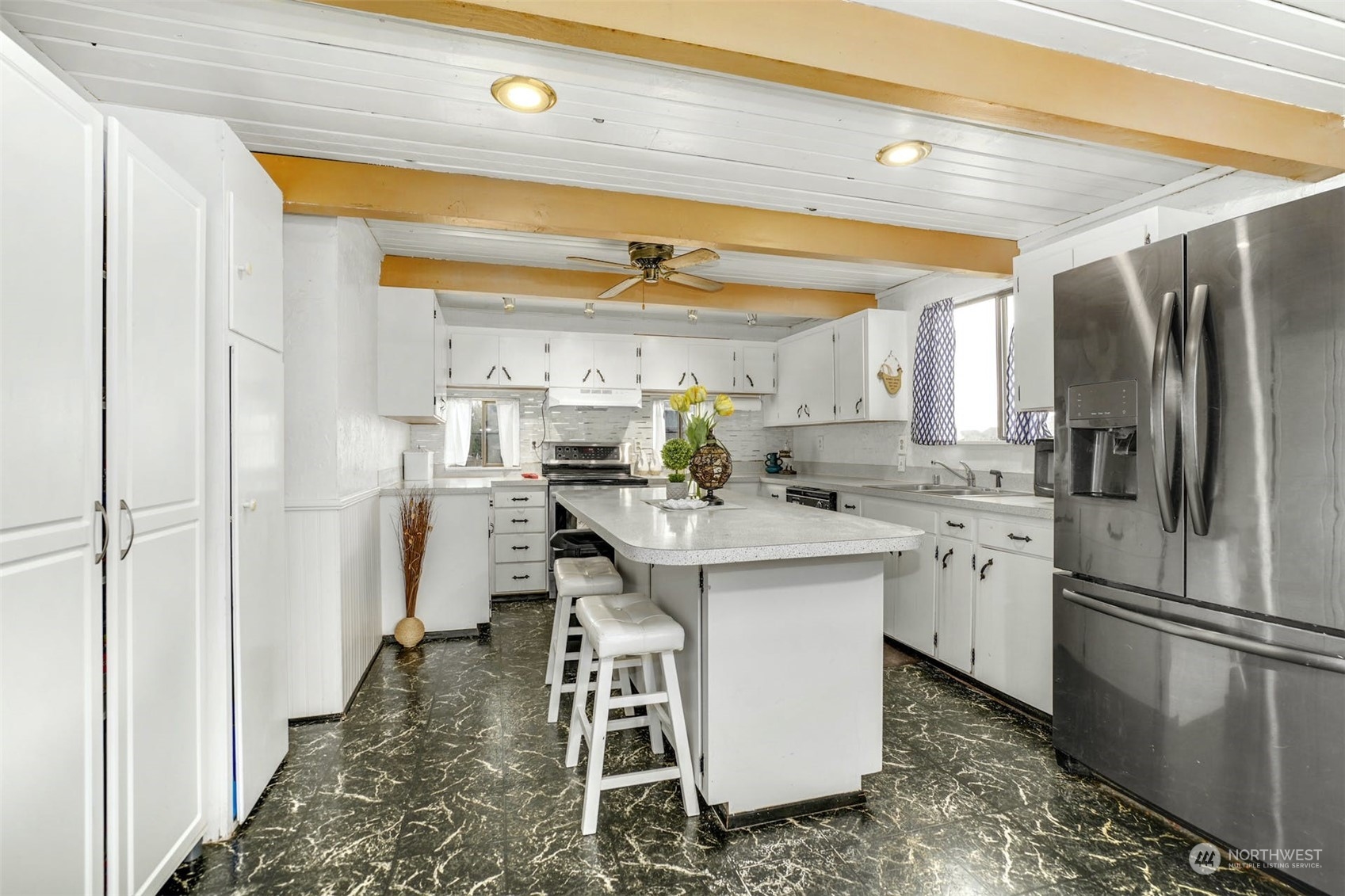 12006 Alexander Road Everett, WA 98204 - Photo 10 of 33 a kitchen with a sink appliances and cabinets