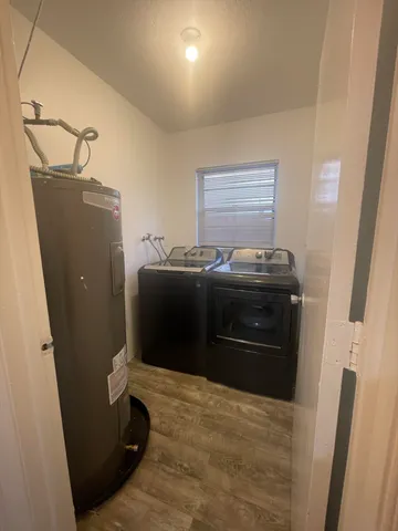 a kitchen with a refrigerator and a stove