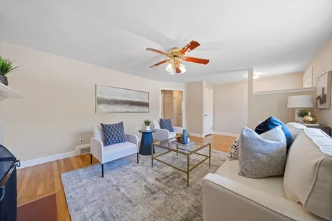a living room with furniture and a rug