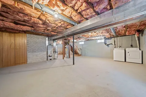 a view of empty room with wooden ceiling