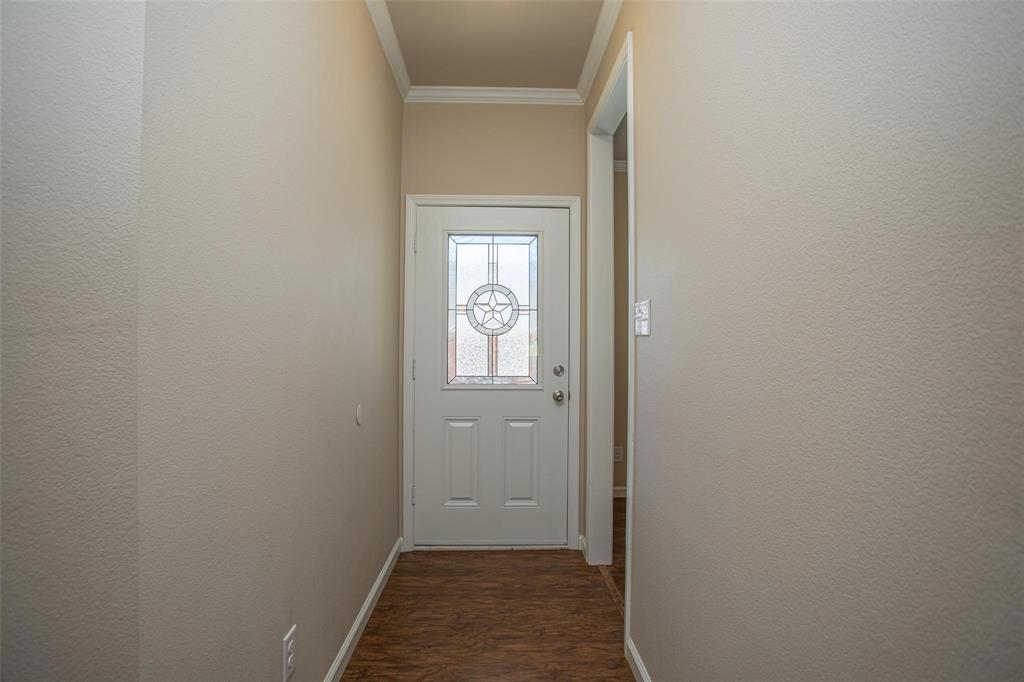 457 Neals Hill Road Oak Ridge, TX 76240 - Photo 12 of 14 a view of a hallway with wooden floor