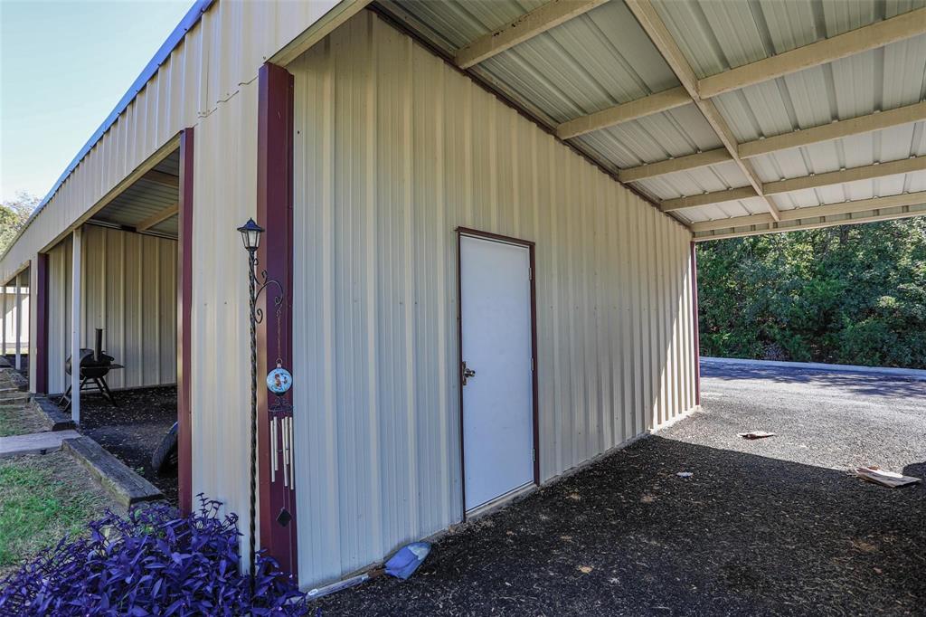 457 Neals Hill Road Oak Ridge, TX 76240 - Photo 14 of 14 a view of backyard with potted plants