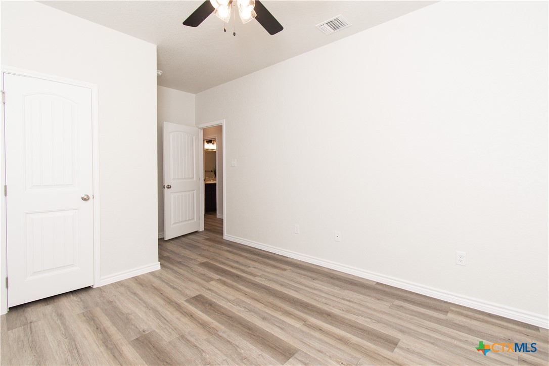 121 Leon Lane, Unit B Copperas Cove, TX 76522 - Photo 13 of 18 a view of an empty room with wooden floor