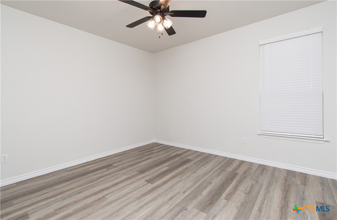 121 Leon Lane, Unit B Copperas Cove, TX 76522 - Photo 14 of 18 wooden floor in an empty room