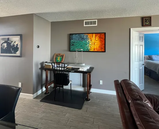 a bedroom with bed and window