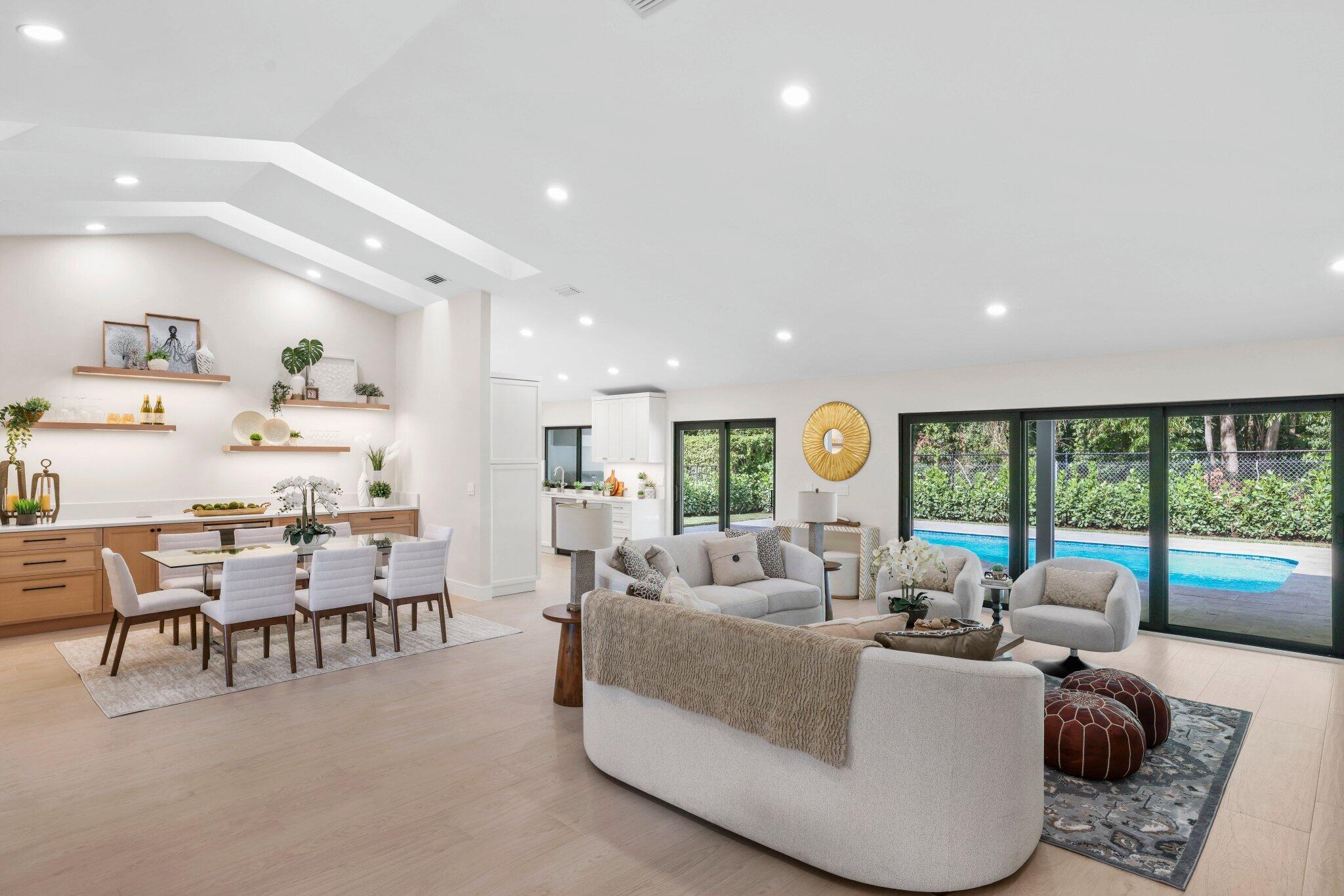 3901 Northwest 27th Avenue Boca Raton, FL 33434 - Photo 11 of 56 a living room with furniture and a large window