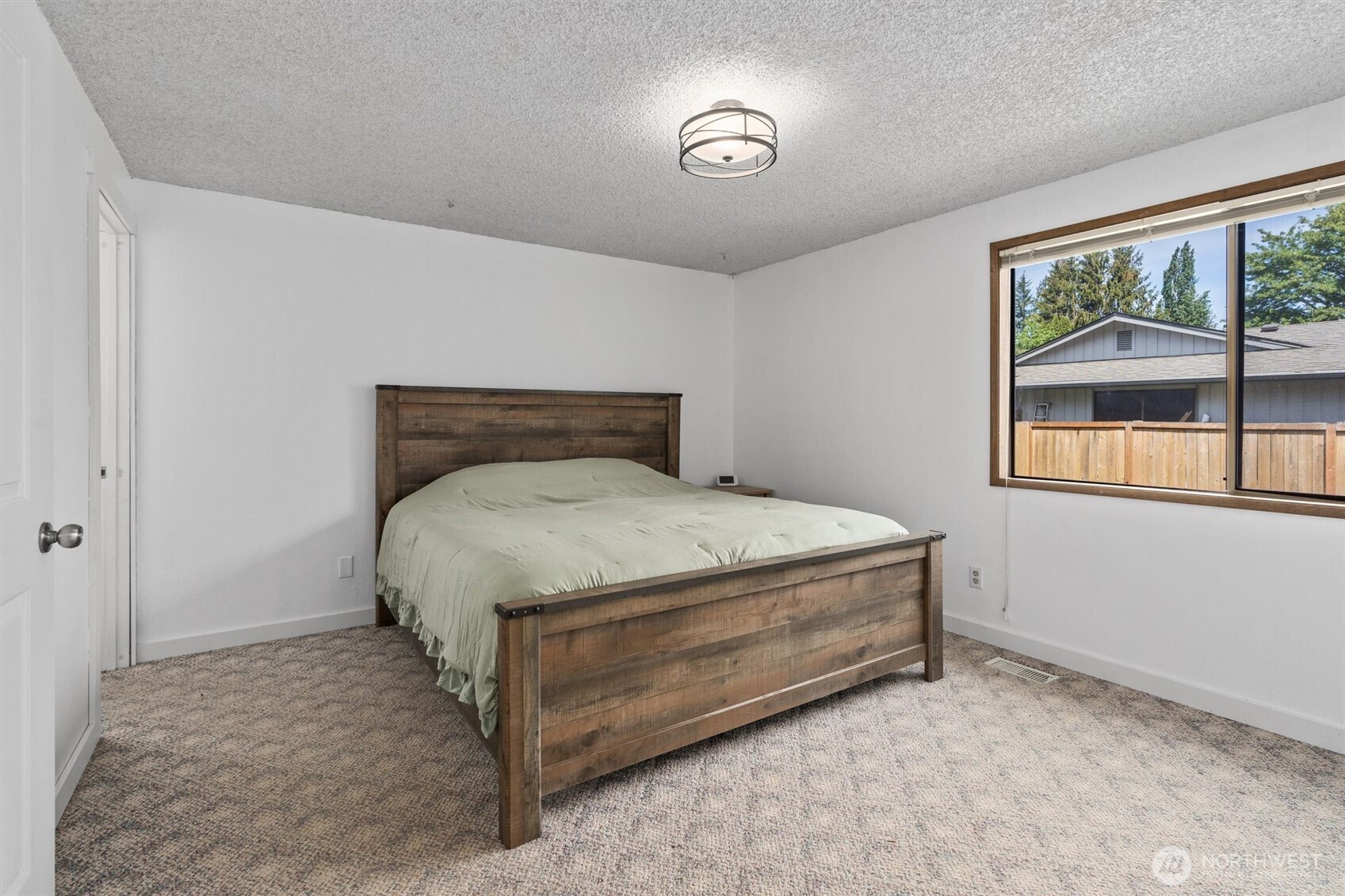 917 Dyer Road Sultan, WA 98294 - Photo 14 of 40 a bed sitting in a bedroom next to a window