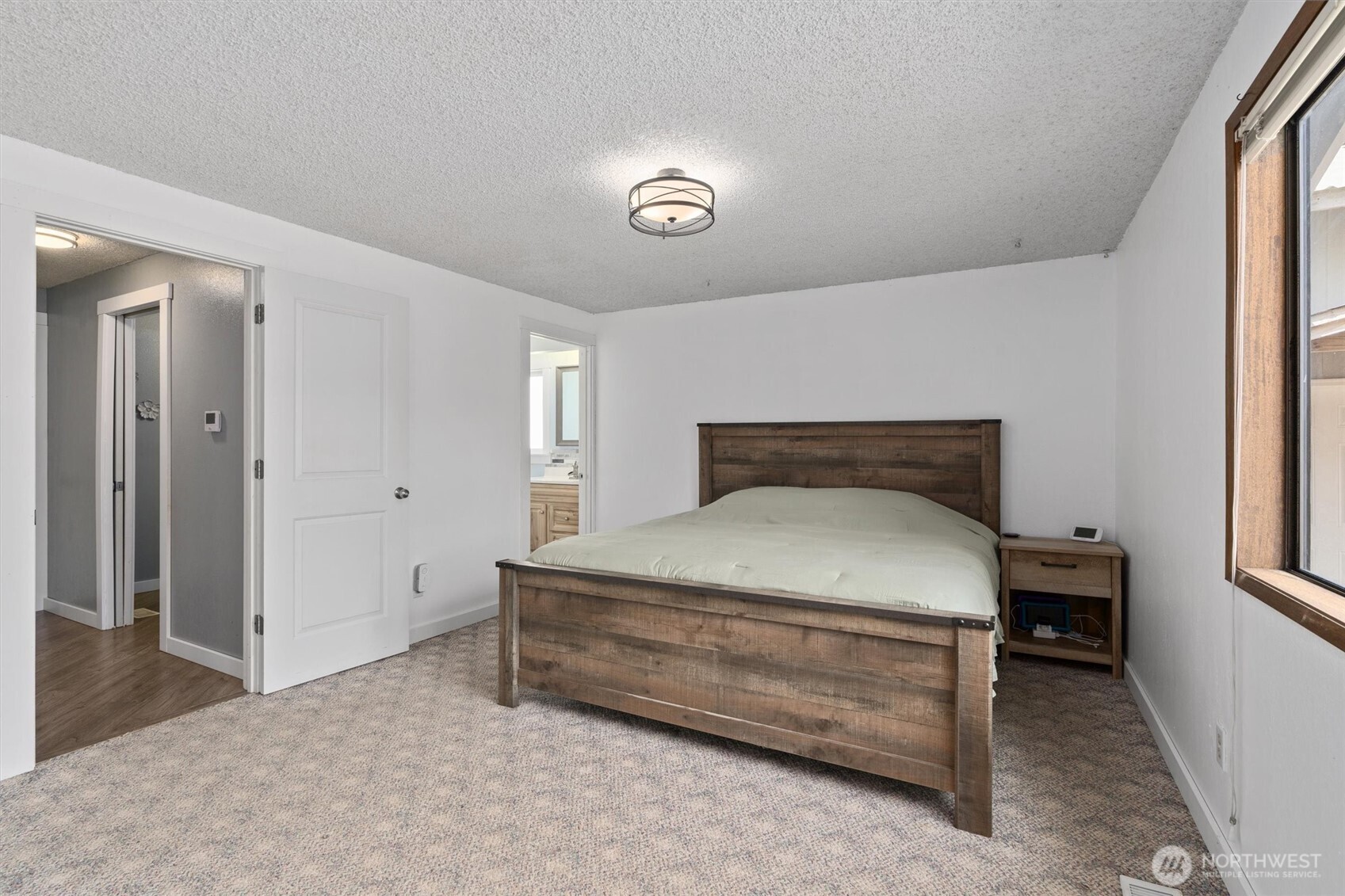 917 Dyer Road Sultan, WA 98294 - Photo 15 of 40 a bedroom with a bed and a table