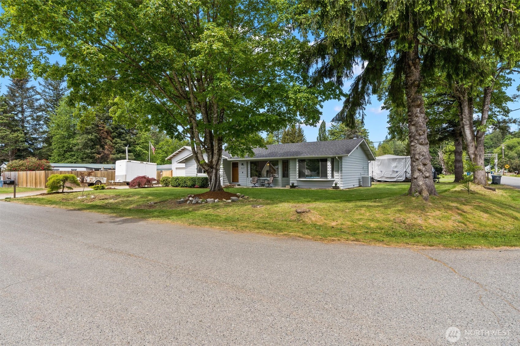 917 Dyer Road Sultan, WA 98294 - Photo 25 of 40 a view of house with outdoor space and trees around