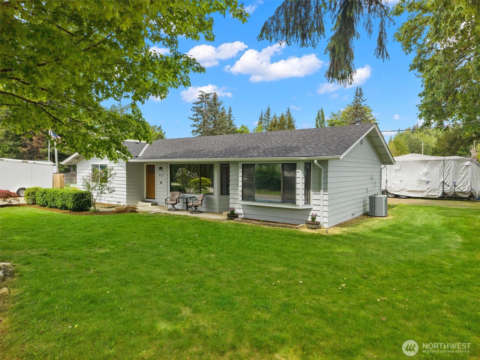 917 Dyer Road Sultan, WA 98294 - Photo 26 of 40 a front view of a house with a garden and porch