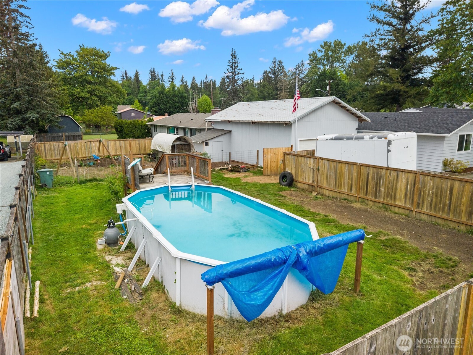 917 Dyer Road Sultan, WA 98294 - Photo 34 of 40 a view of a house with pool and chairs