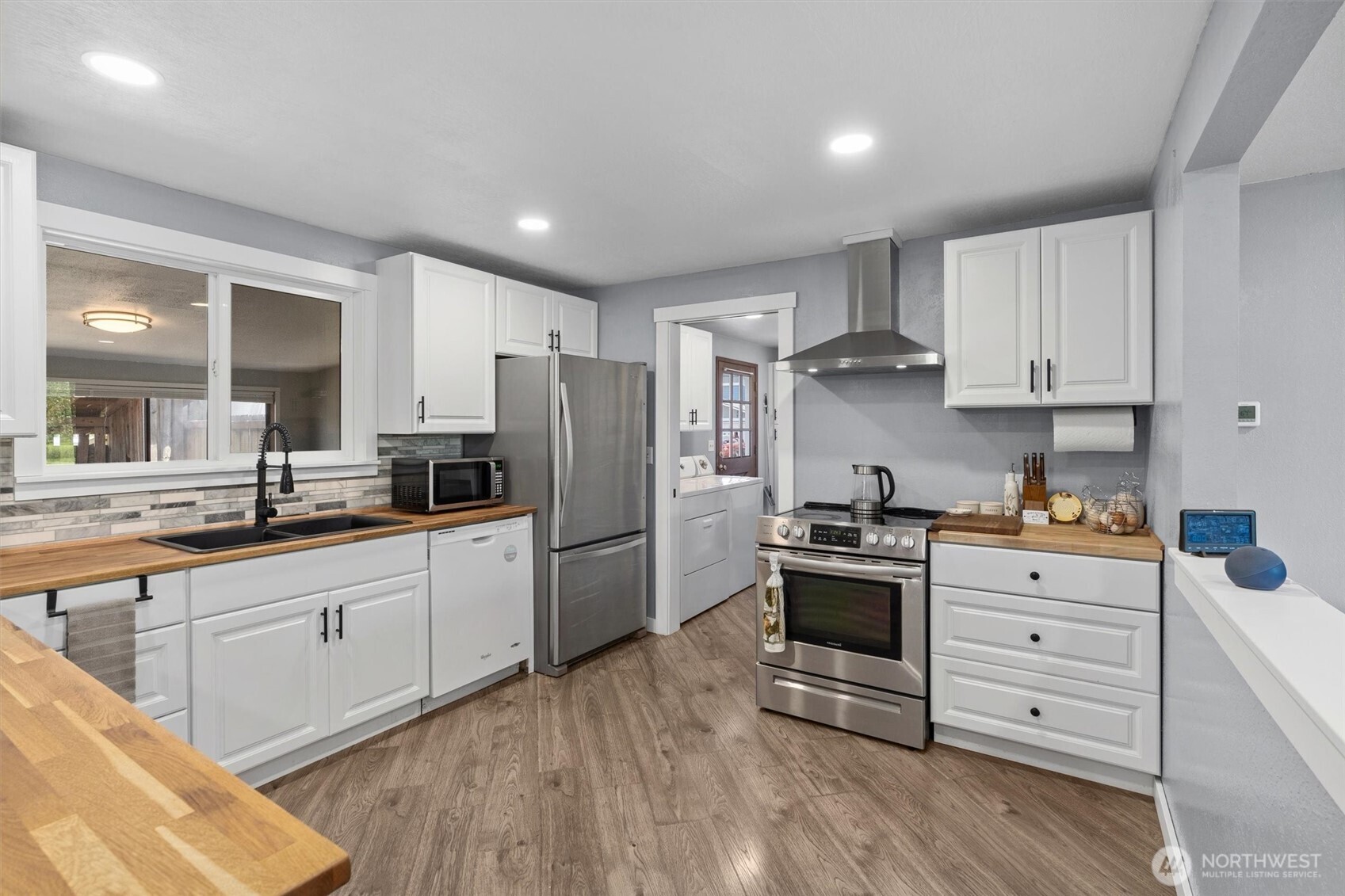 917 Dyer Road Sultan, WA 98294 - Photo 7 of 40 a kitchen with stainless steel appliances white cabinets and a refrigerator