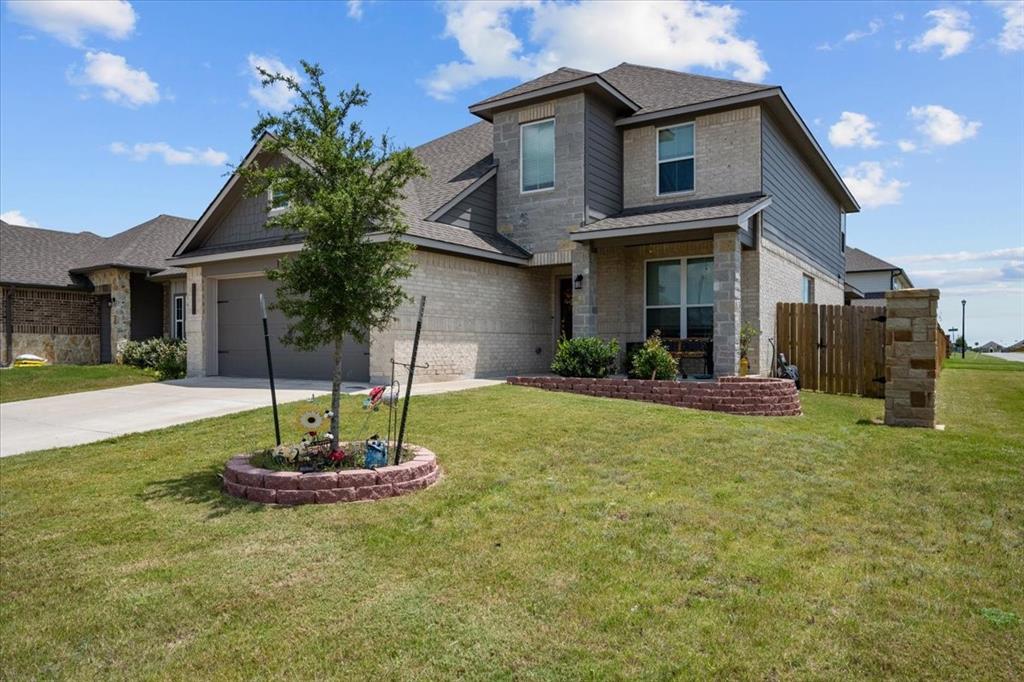 3501 Beutel Road Lorena, TX 76655 - Photo 2 of 33 View of front of property with driveway, brick siding, an attached garage, and a shingled roof