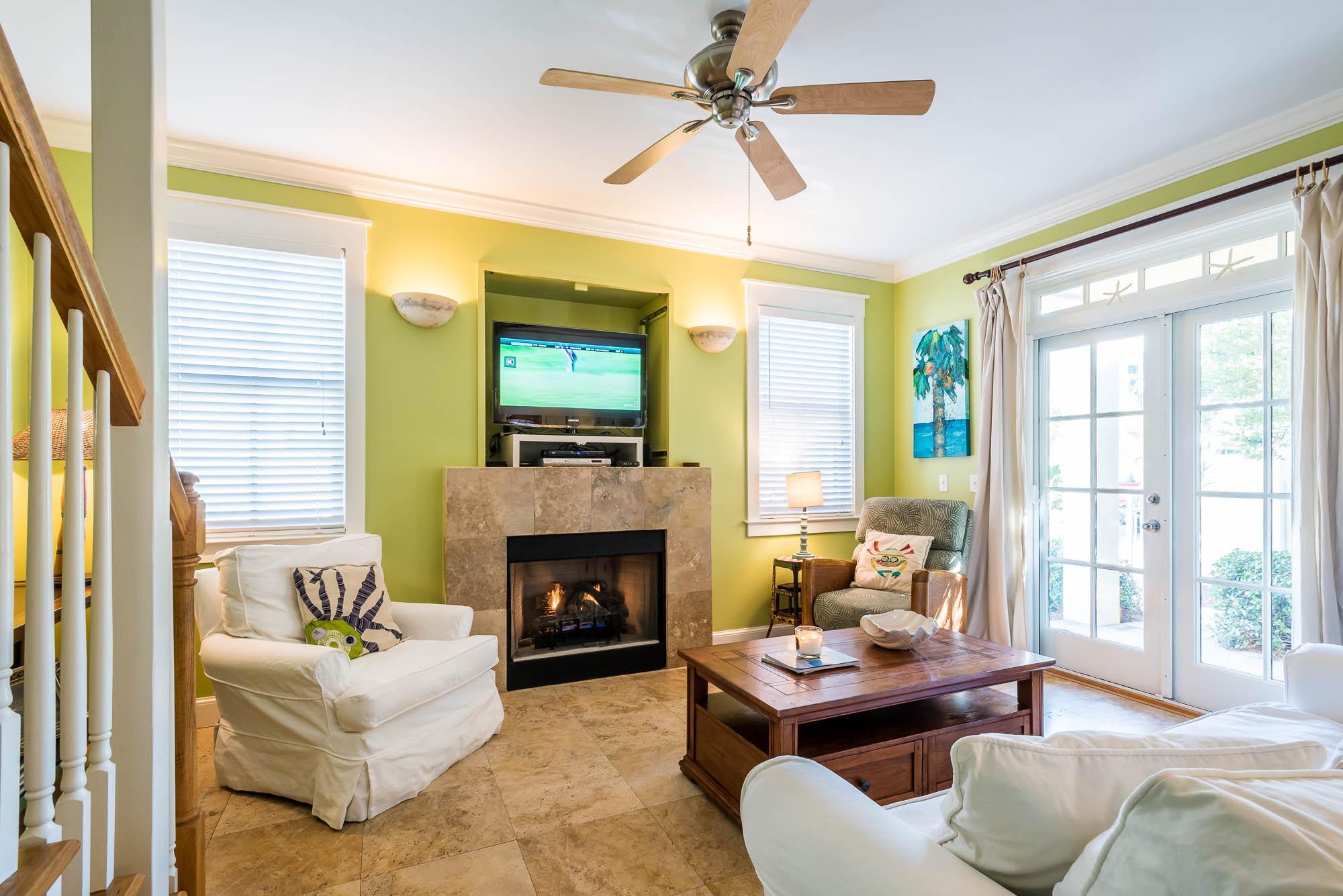 10140 East County Highway 30A, Unit 14 Inlet Beach, FL 32461 - Photo 9 of 14 a living room with furniture flat screen tv and a fireplace