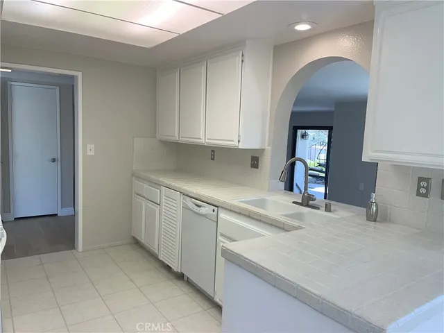 a kitchen with a sink and cabinets