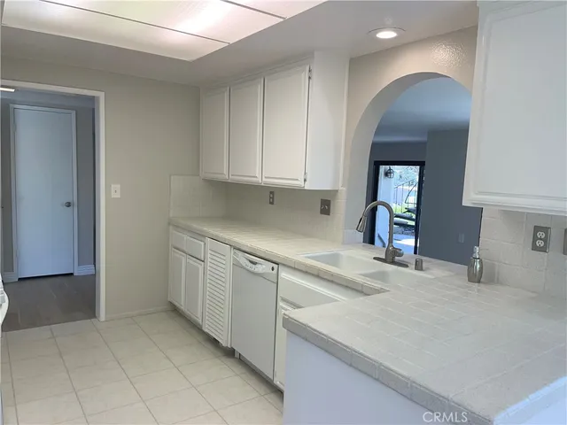 a kitchen with a sink and cabinets